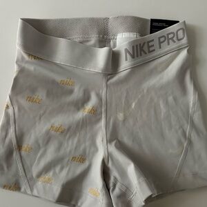 Nike Pro Women's Athletic Shorts in Gray and Gold